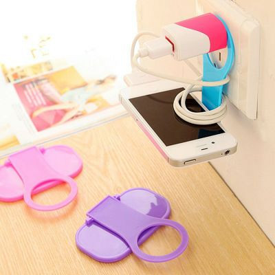 Support de charge pour téléphone portable est un accessoire pratique conçu pour maintenir votre appareil pendant qu'il est branché à une prise murale.Conception Pliable