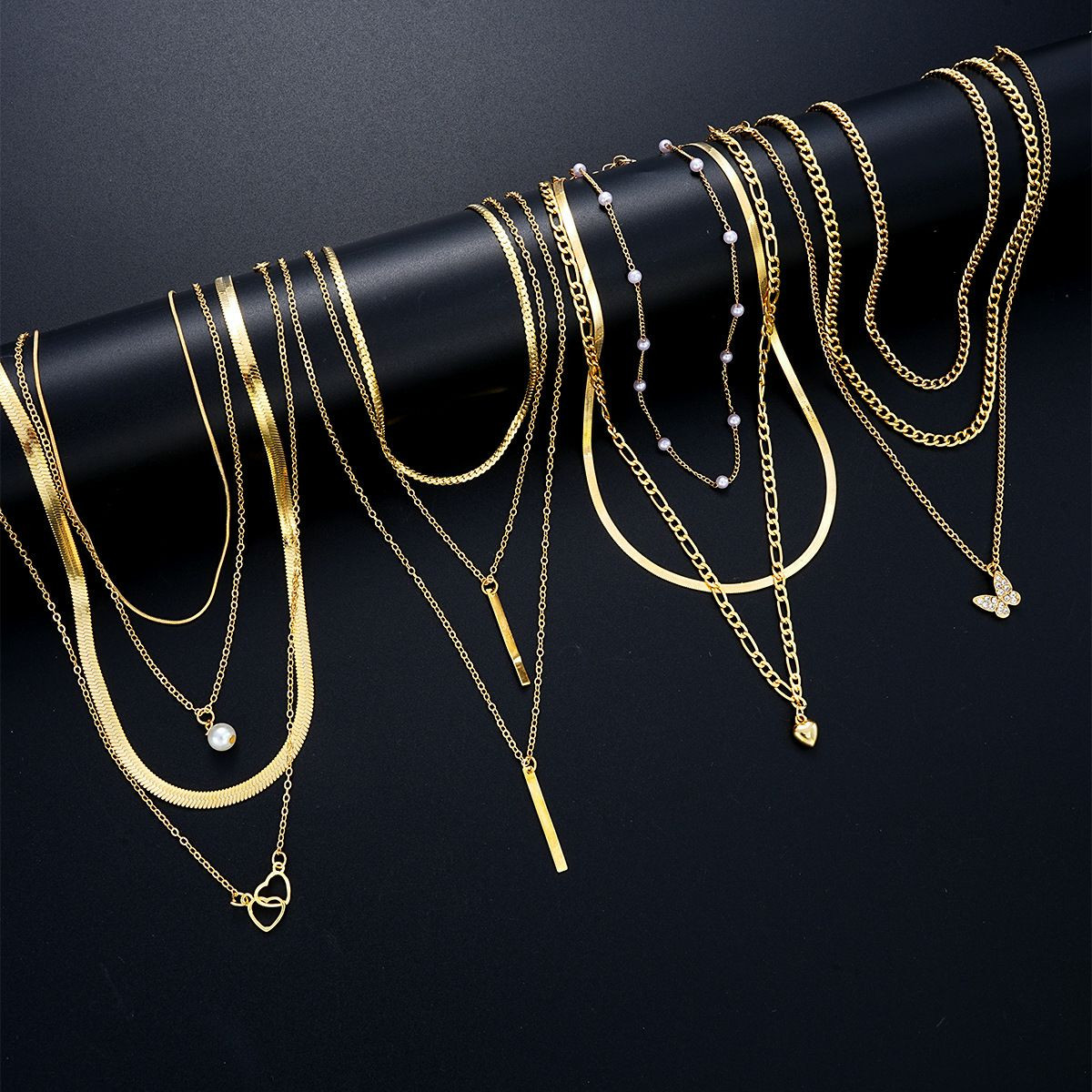 Ensemble de colliers fantaisie multicouches pour femme, style européen et américain, avec chaînes géométriques originales, chaîne en alliage et pendentif cœur allongé.